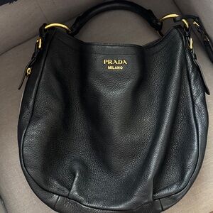 Prada Black Leather Hobo Bag with Gold Accents